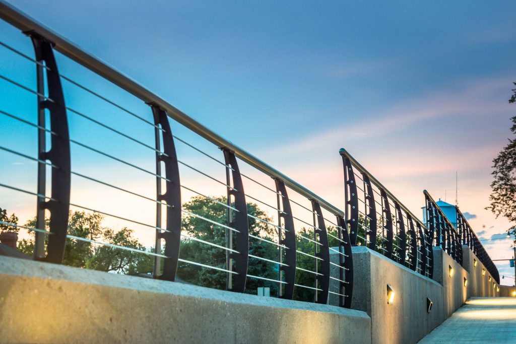 Concrete Retaining wall with the Keuka Style Curved railing and round top rail