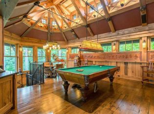 Lake Placid home interior with iron railing. 