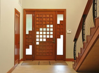 Entrance to modern home with curved cable railing