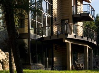 Balcony and deck with keuka style cable railing on concrete log home