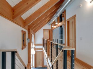 Balcony and staircase with wood top rail