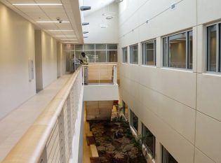 Balcony at a college overlooking a garden atrium