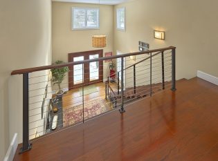 Balcony overlooking entry through cable railing