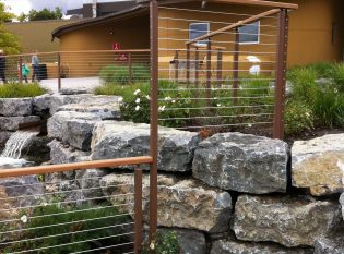 Beautiful blend of stone, greenery and water create an oasis at this Syracuse Zoo