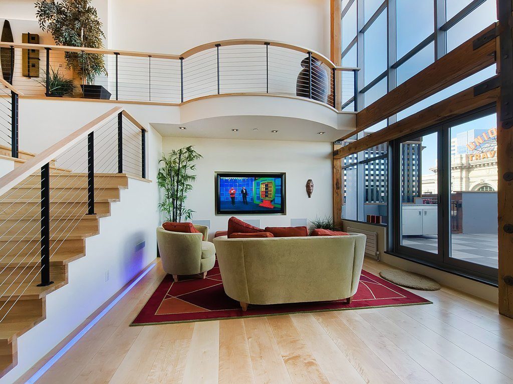 Curved second story loft with cable railing