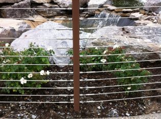Cable railing with view of the vegetation and rock gardens