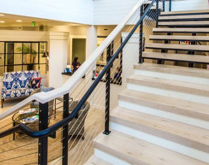 Cable stair railing on a commercial site.