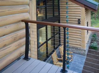 Composite deck with stainless cable railing and wood banister