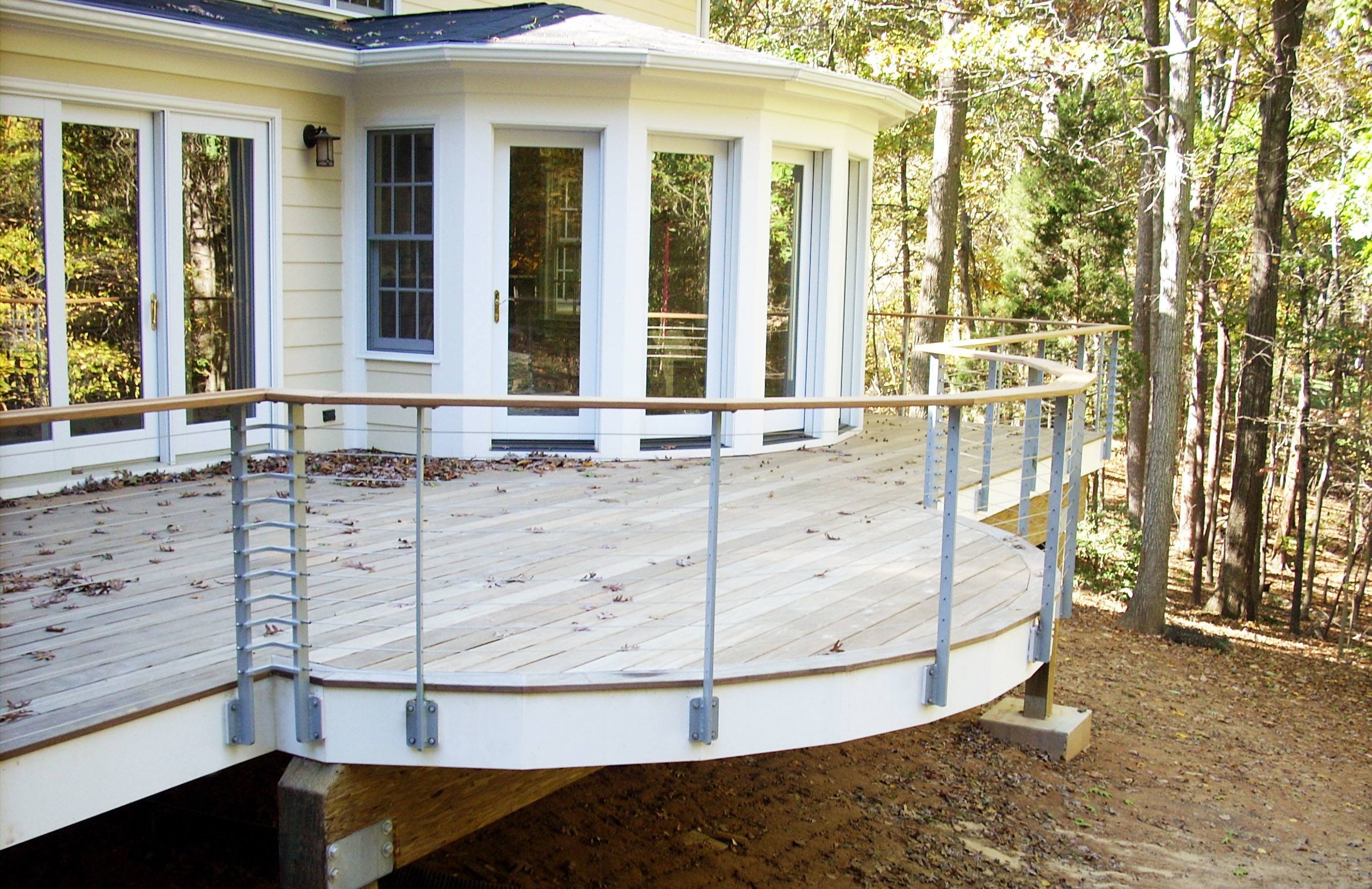 Curved ipe deck with custom posts and 316 stainless cables and fittings