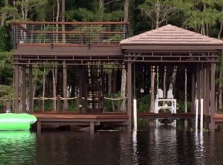 Deluxe boathouse with cable railings
