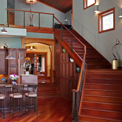 Cherry staircase cable railing in the Chicago Style with custom designed newel post -Delwan Wi