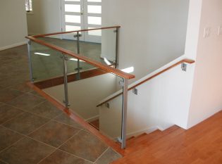 Glass rail around interior stairwell