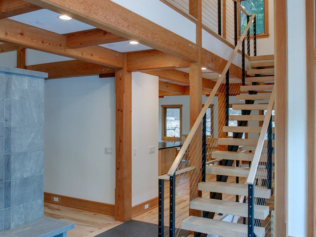 Interior cable railing and double stringer staircase and maple treads. The cable railing post and stringer color is Raven Black.