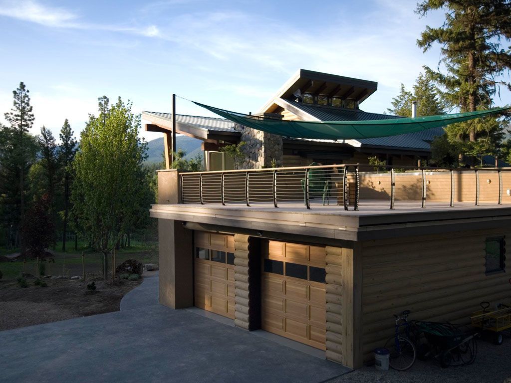 Deck railing over a garage.