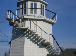 Residential light house wrap around deck