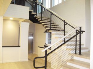 Light Wood And Dark Steel Railing Creates A Striking Contrast