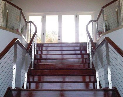 Stainless steel stair railing with mahogany treads