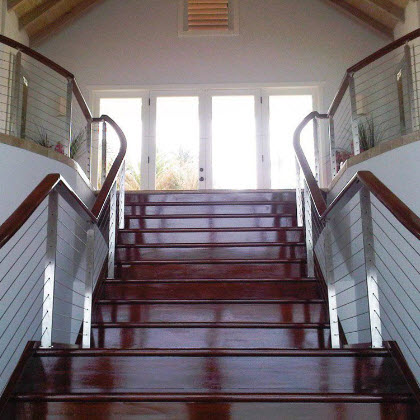 Stainless steel stair railing with mahogany treads