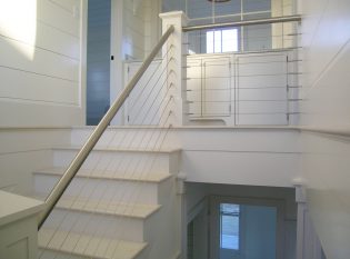Nantucket white bead board and stainless steel railings
