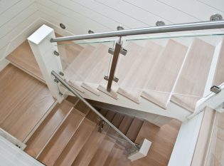 Glass railing with stainless steel hand rail