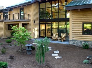 Outdoor deck and keuka railing on concrete log home