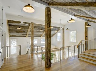 Overlooking this open indoor space through the cable railing