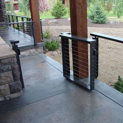 Custom cable railing designs include the Prairie Cable railing and gate with a Pine Tree cut out in the post