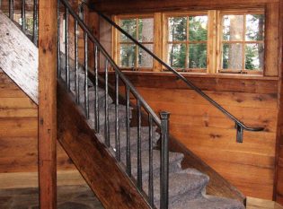 Rustic iron railing with wax finish applied by hand. 