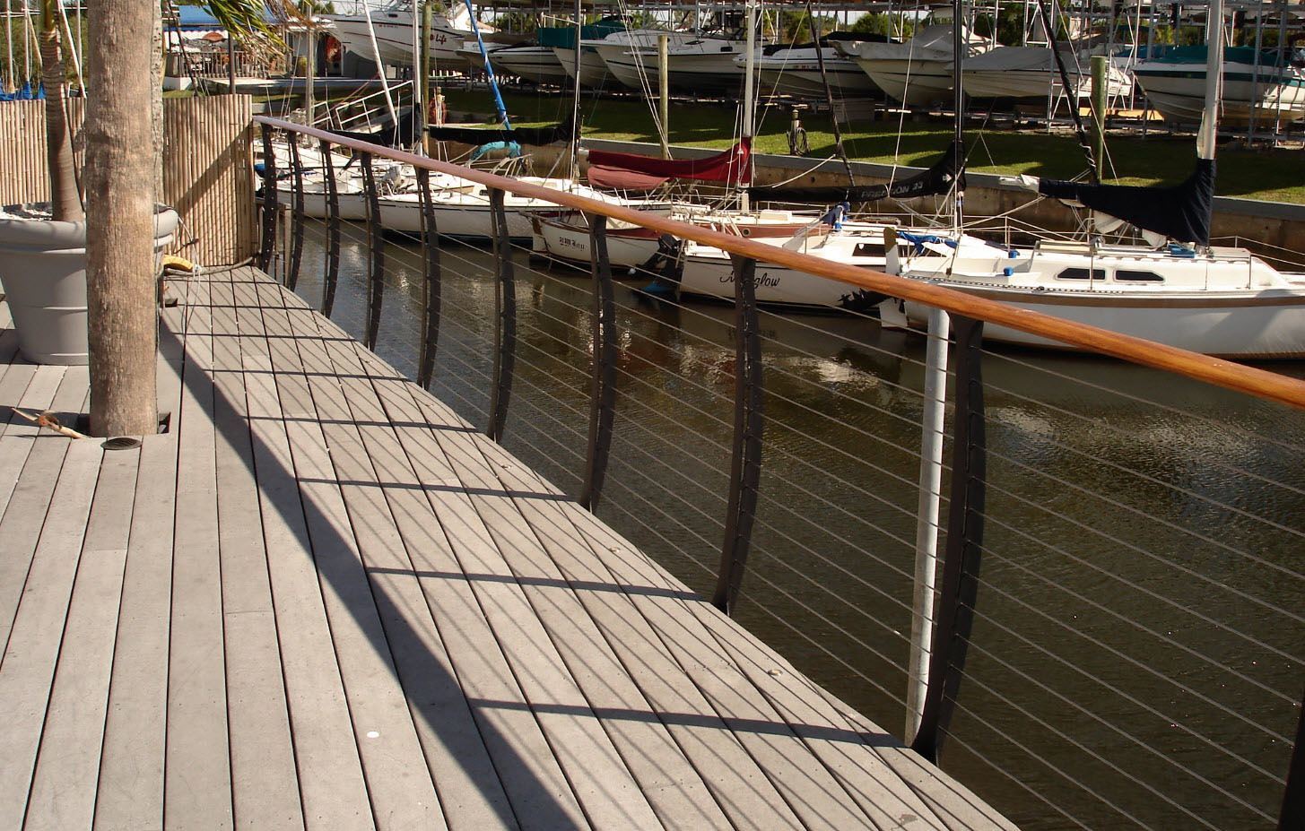Sailboats and harbor cable railing views