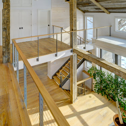 Indoor cable railings and stairs were made for this party barn with half basketball court