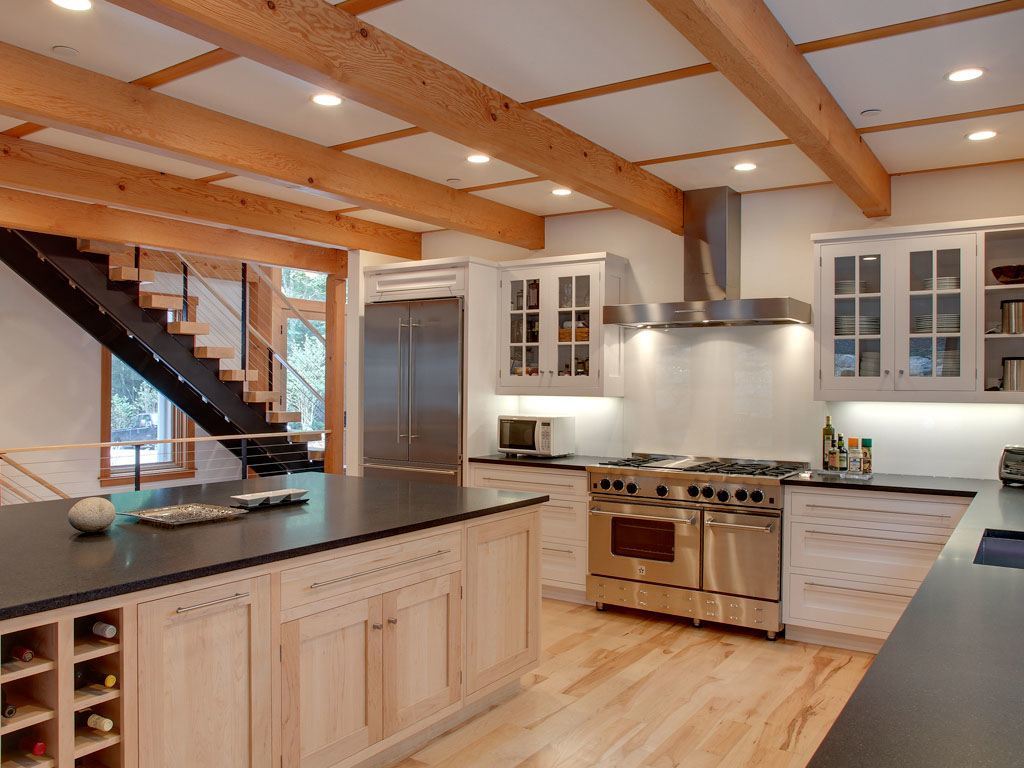 Double stringer steel staircase leading from the kitchen to the second story.