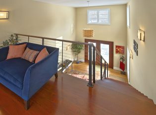 Staircase and balcony to front entry