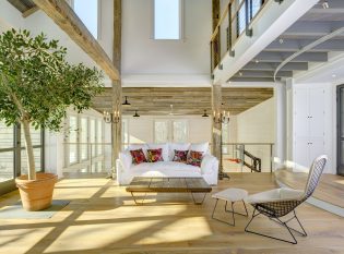 Balcony railing overlooks basketball court and stage