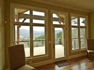 This cable railing opens up the view of the mountains making the outdoor view larger from inside