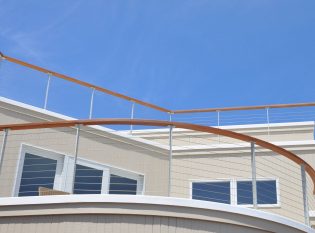 This Ithaca style Anodized Aluminum cable railing complements this Jersey shore home