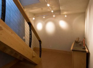 Timber stair with curved cable railing
