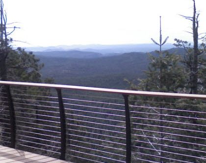 log cabin deck cable railing with breath taking view of the forest