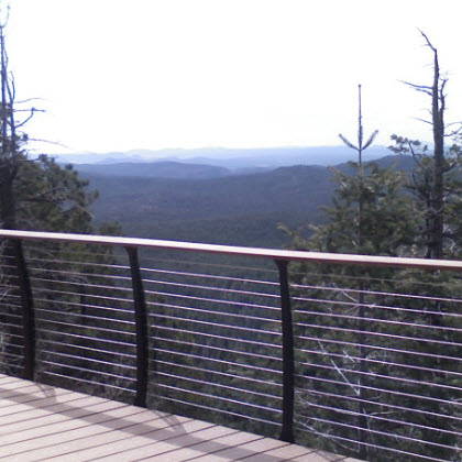 log cabin deck cable railing with breath taking view of the forest