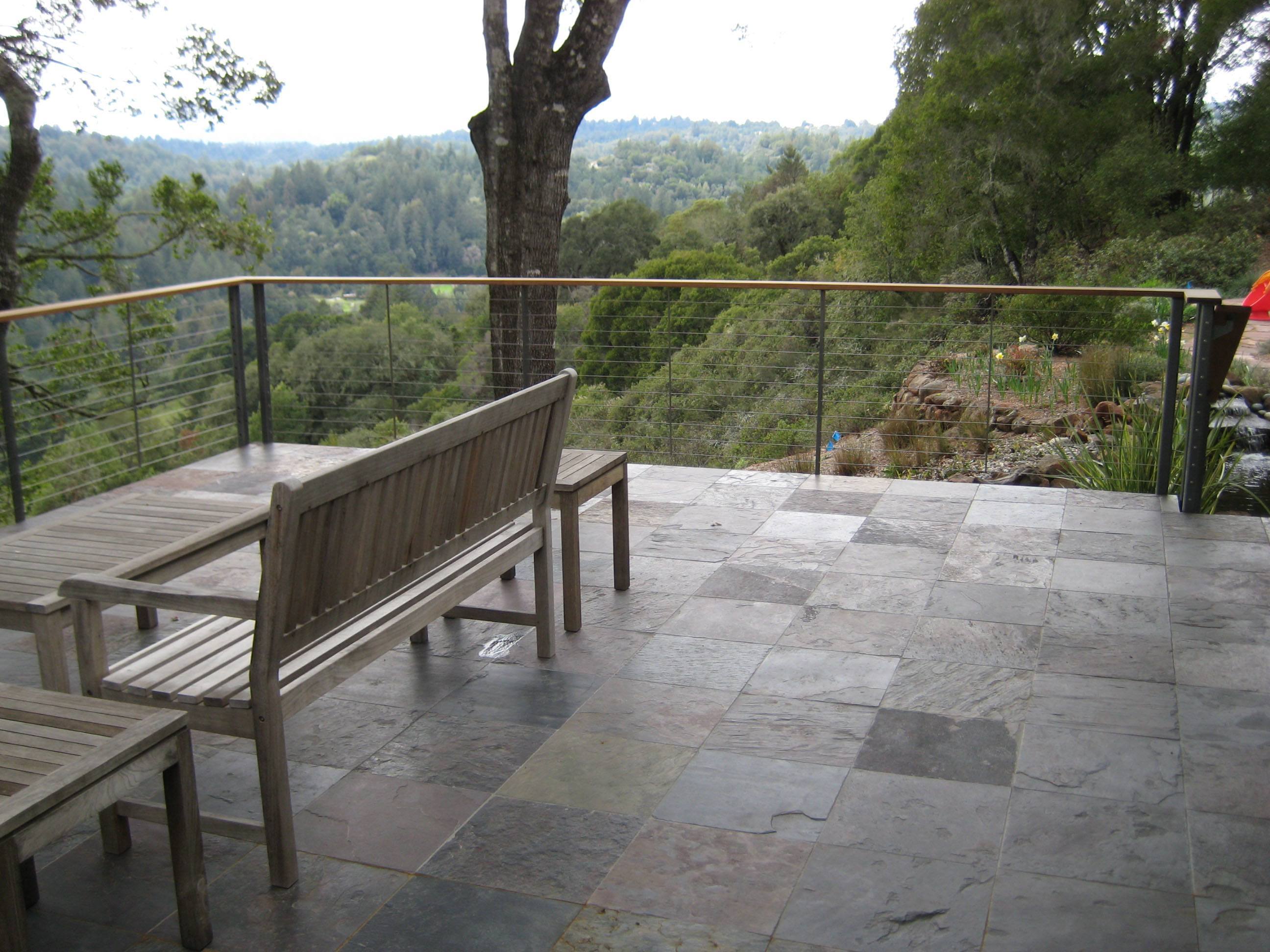 Wood top rail, slate deck and metal railing create an aesthetically pleasing escape