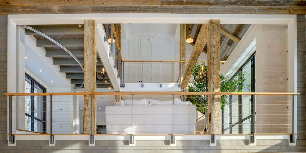 Ithaca style cable railing show on multiple interior levels of a party barn.