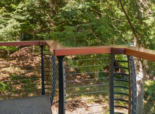 Keuka curved cable railing with wood top rail