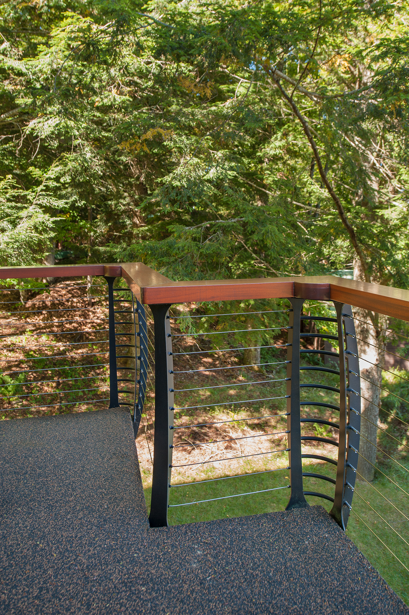 Keuka curved cable railing with wood top rail
