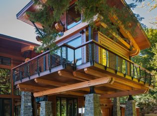 Sun room with exposed wood beams and curved cable railing