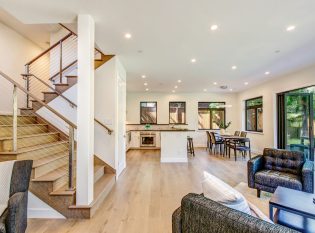 Living room and kitchen with staircase