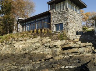 Stone house with Keuka railing