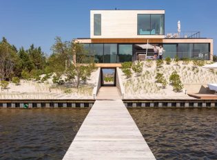 Hurricane resistant home built 15 ft above sea level to allow for a storm surge canal.