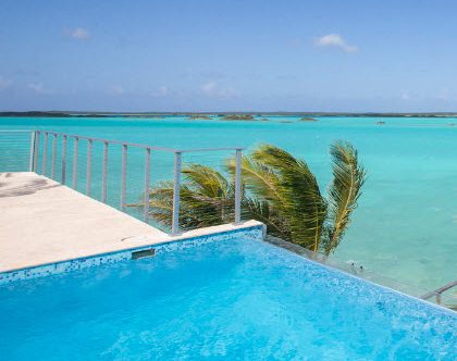 Infinity edge pool patio railing on island villa