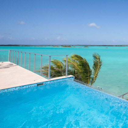 Infinity edge pool patio railing on island villa