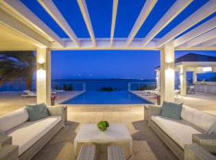 Pergola with night lighting and infinity edge pool