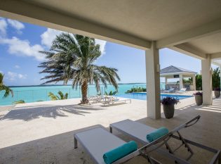 Covered Deck with cable railings an expansive water view